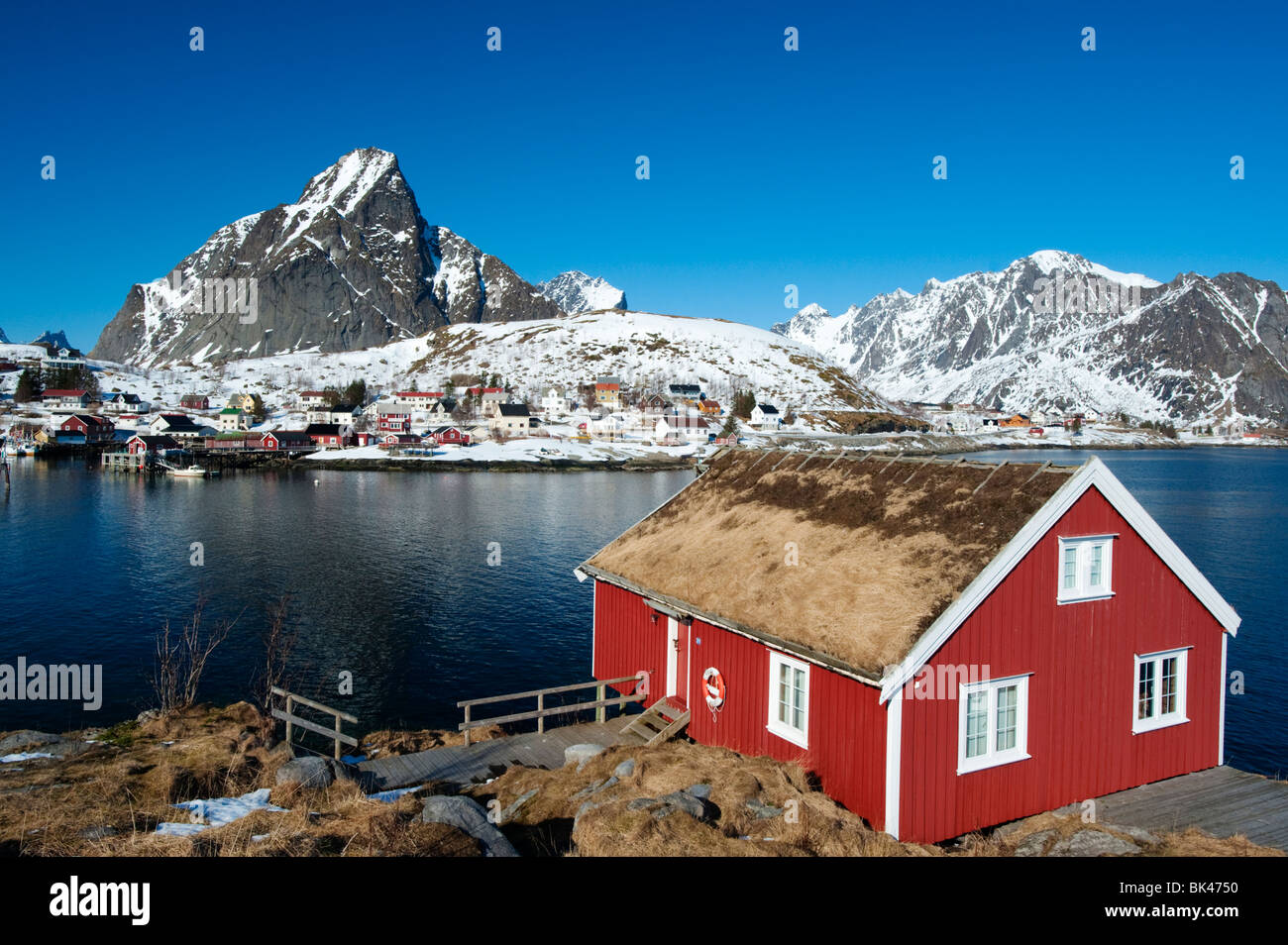 Lofoten Islands; Traditional red wooden Rorbu fisherman`s hut in village of Reine in Lofoten Islands, Norway Stock Photo